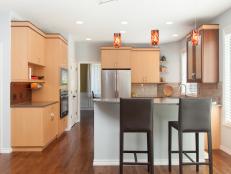 Neutral Contemporary Eat-In Kitchen With Two Brown Barstools