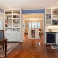 Traditional Living Space Features Wet Bar & Bookshelves