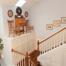 Traditional Stairway Landing With Antique Display
