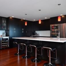 Contemporary Eat-In Kitchen With All-Black Cabinetry