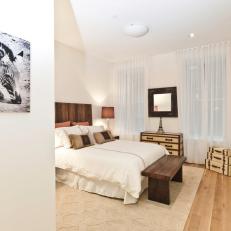 Elegant White Guest Room With Zebra Artwork