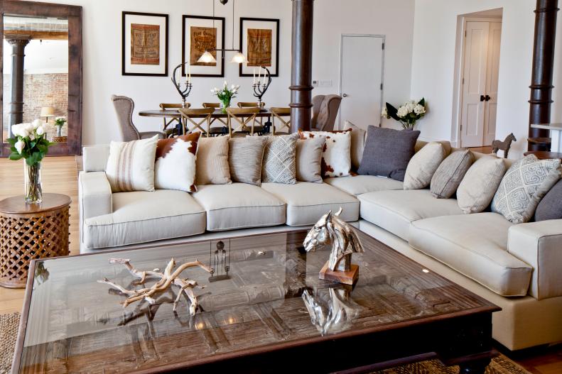 White Contemporary Living Room With Neutral Sectional & Throw Pillows