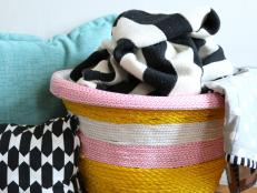 A basic, inexpensive plastic laundry basket is made whimsical and colorful with stripes of rope. Look for fun rope in your local hardware store. Experiment with a variety of colors and thicknesses to match your decor.