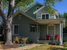 Small Gray Exterior With Red Chairs on Front Porch