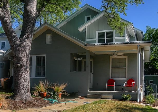 Small Gray Exterior With Red Chairs on Front Porch