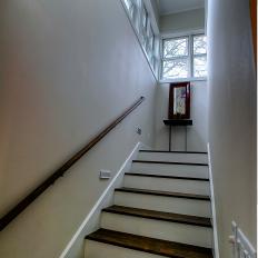 Bright Stairwell Features Dark Wood Steps