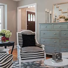 Black & White Striped Armchairs in Feminine Gray Living Room