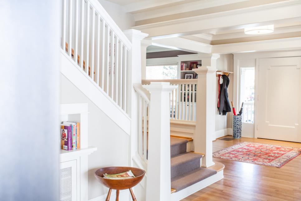 Neutral Transitional Foyer With White Staircase