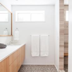 Modern White Bathroom Features Brown Mosaic Tile Floors