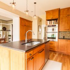 Open Craftsman Kitchen Features Stained Alder Cabinets