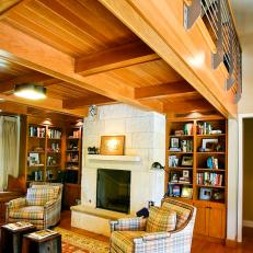 Cozy Transitional Living Area With Plaid Armchairs & Built-In Bookshelves