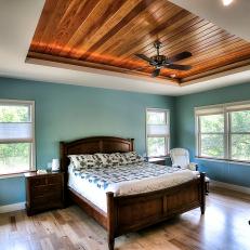 Turquoise Bedroom Features Warm Wood Tray Ceiling