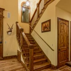 Rustic Stairway With Arched Mirror