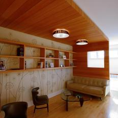 Cozy Home Library With Contemporary Wood Paneling