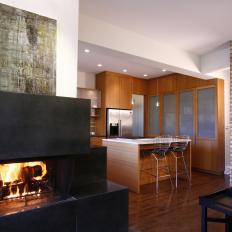 Bold Black Fireplace Beside Contemporary Kitchen