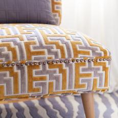 Greek Key-Inspired Upholstery With Nail Head Trim