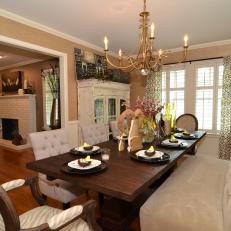Pretty Dining Room With Tufted Bench at Table