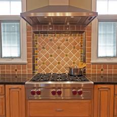 Warm Tile Kitchen Backsplash & Stainless Range Hood