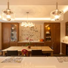 Chic Contemporary Dining Area With Glass Pendant Lights