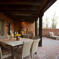 Southwestern Brick Patio With Fireplace and Dining Area