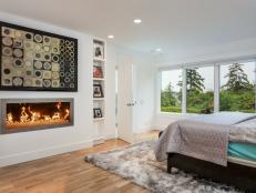 Modern White Bedroom With Fireplace and Large Windows