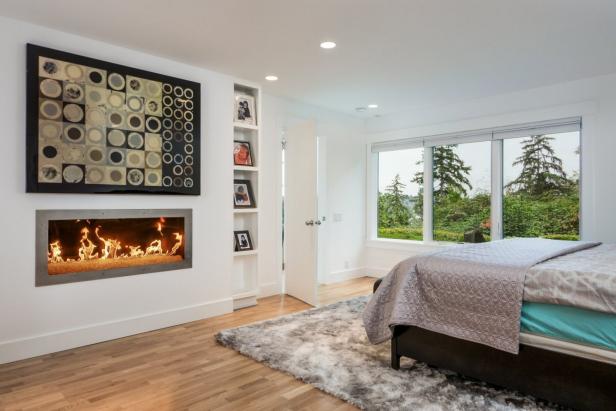 Modern White Bedroom With Fireplace and Large Windows