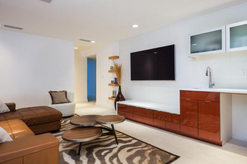 Modern White Living Space With TV, Wet Bar and Brown Leather Sectional