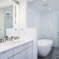 Sleek White Master Bathroom Boasts Ultra-Modern Look