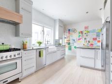 White Contemporary Kitchen With White Cabinets & Light Wood Floors