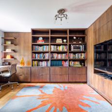 Home Office With Built-In Bookshelves and Television Insert