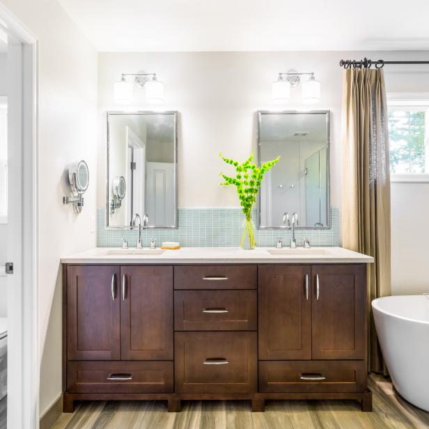 Brown Wood Vanity & Glass Tile Backsplash in Master ...