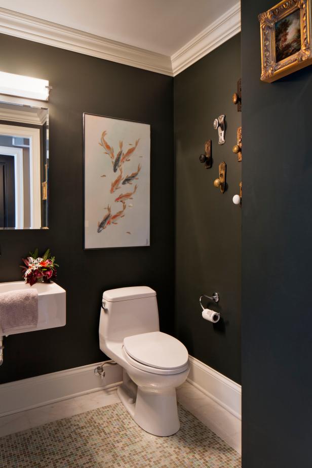 Powder Room Features Fish Art & Wall of Antique Doorknobs