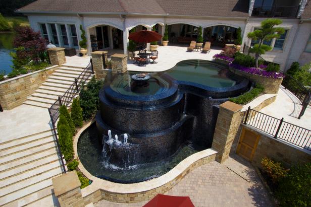 Black Onyx Infinity Pool and Travertine Patio With Stairs