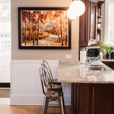 Chic Kitchen Bar With Metal Barstools & Granite Countertop
