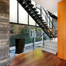 Sleek Staircase Features Ebonized Oak & Steel