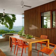 Modern Patio Features Bold, Orange Armchairs