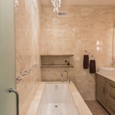 Contemporary Master Bathroom With Marble Walls & Corner Tub