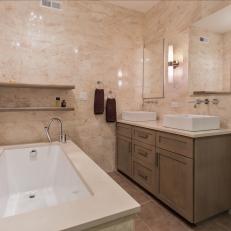 Elegant Marble Bathroom With Double Vanity and Corner Bathtub