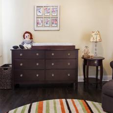 Transitional Kids Room With Striped Rug and Dark Wood Furniture 