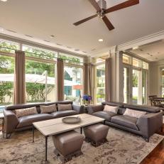 Transitional Family Room Features Pool View