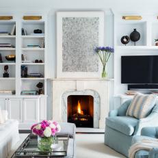 Cool Blue Living Room With Marble Fireplace