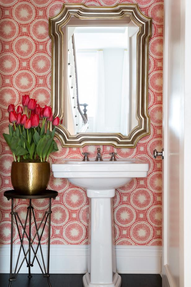 Pink Powder Room With White Pedestal Sink and Pink Flowers