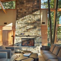 Modern, Rustic Living Room Features Stacked Stone Fireplace