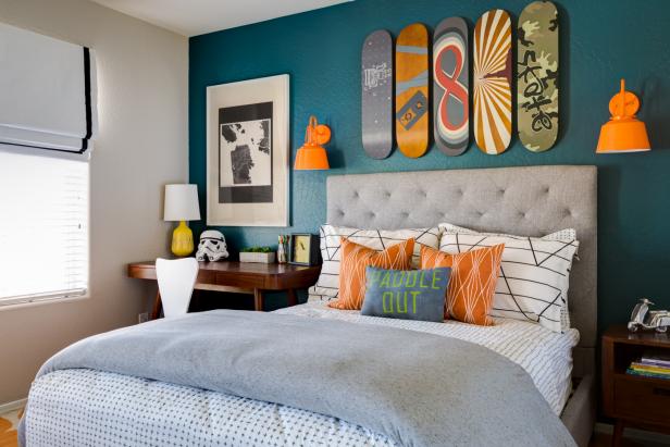 Contemporary Boy's Bedroom With Blue Accent Wall and Skateboard Art
