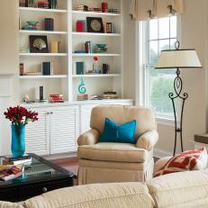 Jewel-Toned Accents Pop in Neutral Family Room