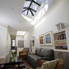 Family Room Features Skylight & Leather Furnishings