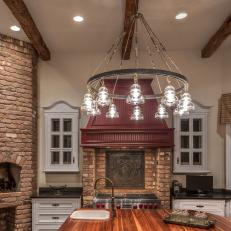 Traditional Kitchen With Funky Chandelier & Brick Pizza Oven