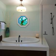 Clean, Timeless Bathroom With Subway Tile Shower
