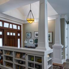 Built-in Bookcases Incorporated Into Foyer Columns