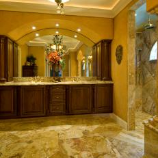 Grand Tuscan-Style Bathroom With Large Wood Vanity